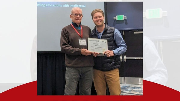 Nathan Lamain accepting the Research Award with Dr. Greg Reid