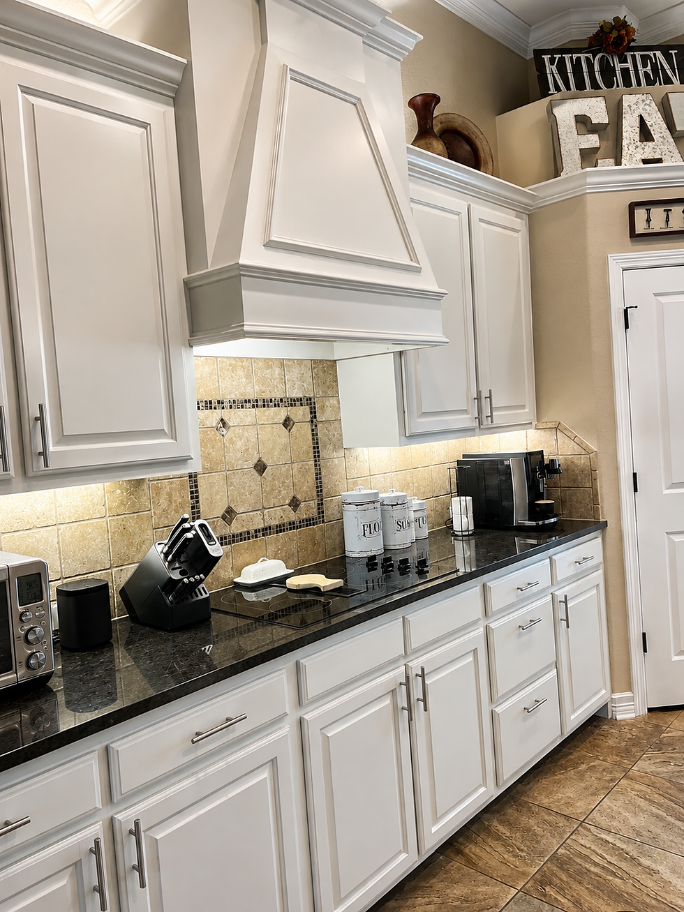 Professionally painted white kitchen cabinets with smooth solid-color finish