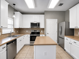 Professionally painted white kitchen cabinets in Austin TX