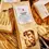 Miniatura: Paccheri rigati Senatore Cappelli pack among artisan pastas on tray, Caravella Fine Food heritage durum tubes