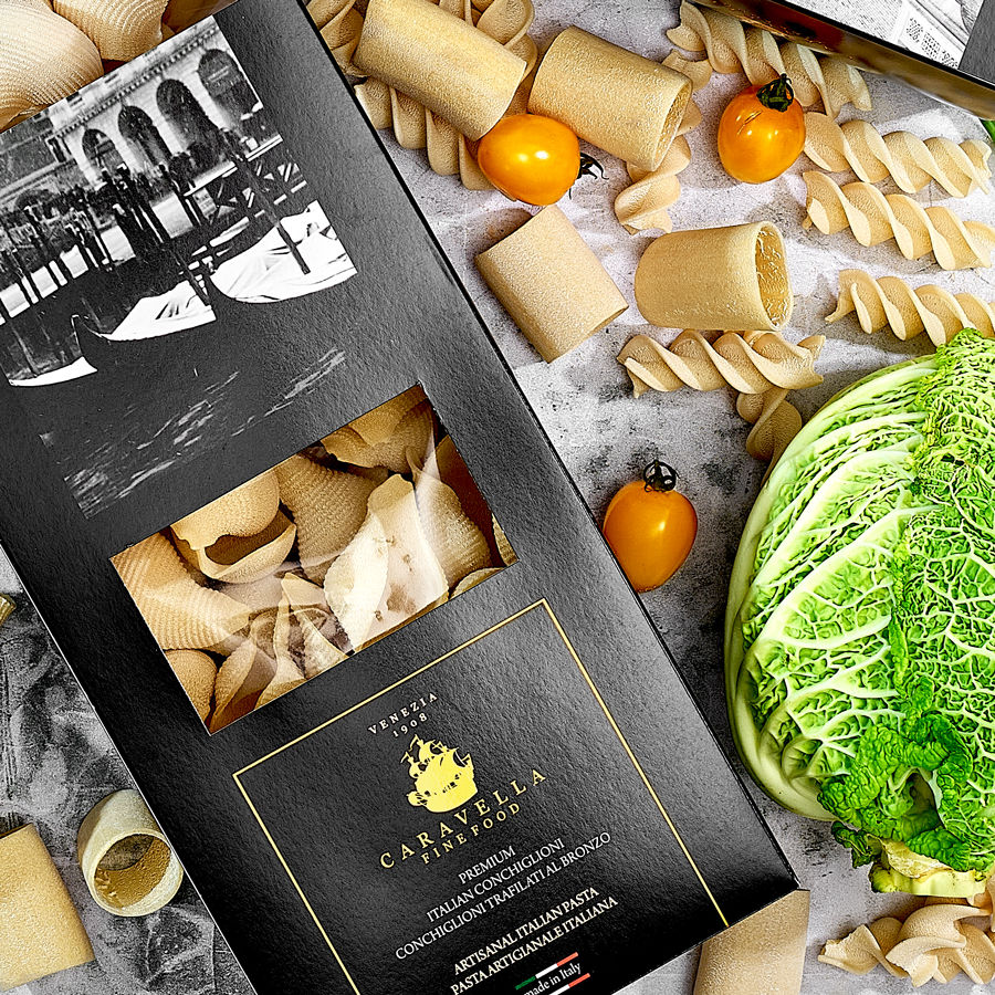 Thumbnail: Caravella Pasta Trio N°1 Conchiglioni, Paccheri, Fusilli in Venice Collection gift box on table with fresh vegetables