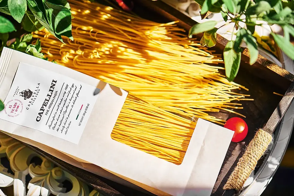 Miniature : Capellini egg pasta pack with bronze-drawn strands in a wooden tray, artisan texture, natural light.
