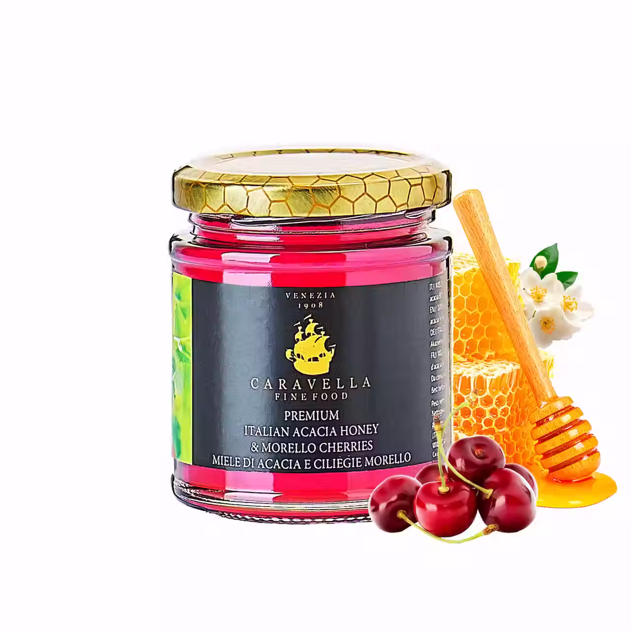 Acacia Honey with Cherry – Caravella Fine Food jar with black label, gold honeycomb lid, honey dipper and fresh cherries.