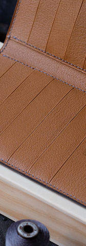 Long wallet no. 60 Decoster entirely handmade and hand-sewn in burnt earth goat and gold goat. Designed to hold at least 12 cards, your tickets, your documents, but also your passport which will fit entirely in one of the two pockets under the cards. The ideal companion for those who want to take everything with them.