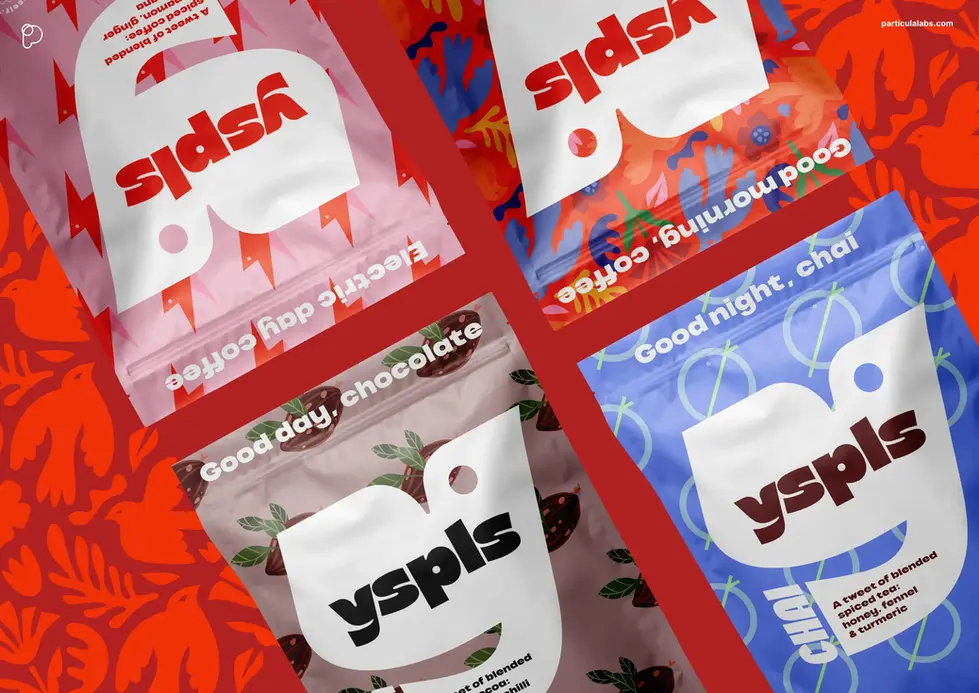 four bags of yspls coffee are lined up on a table