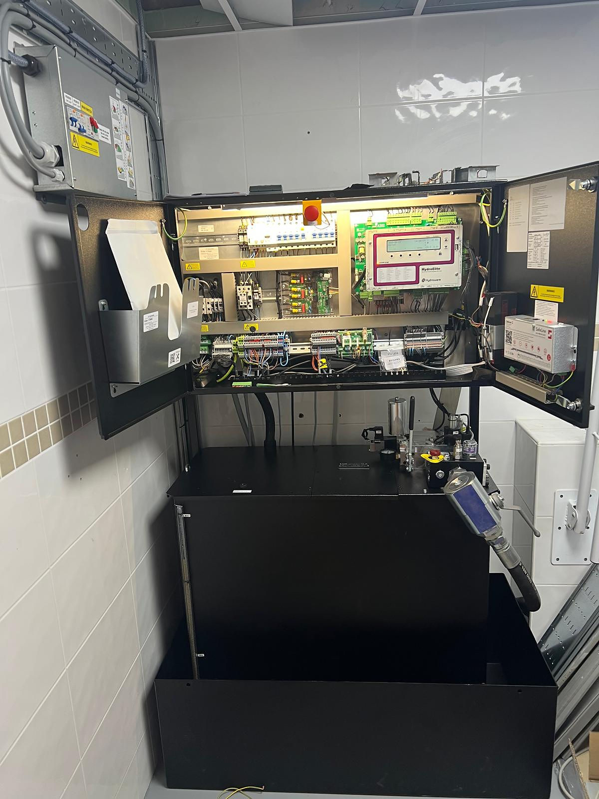 Close-up view of elevator technician repairing elevator machinery