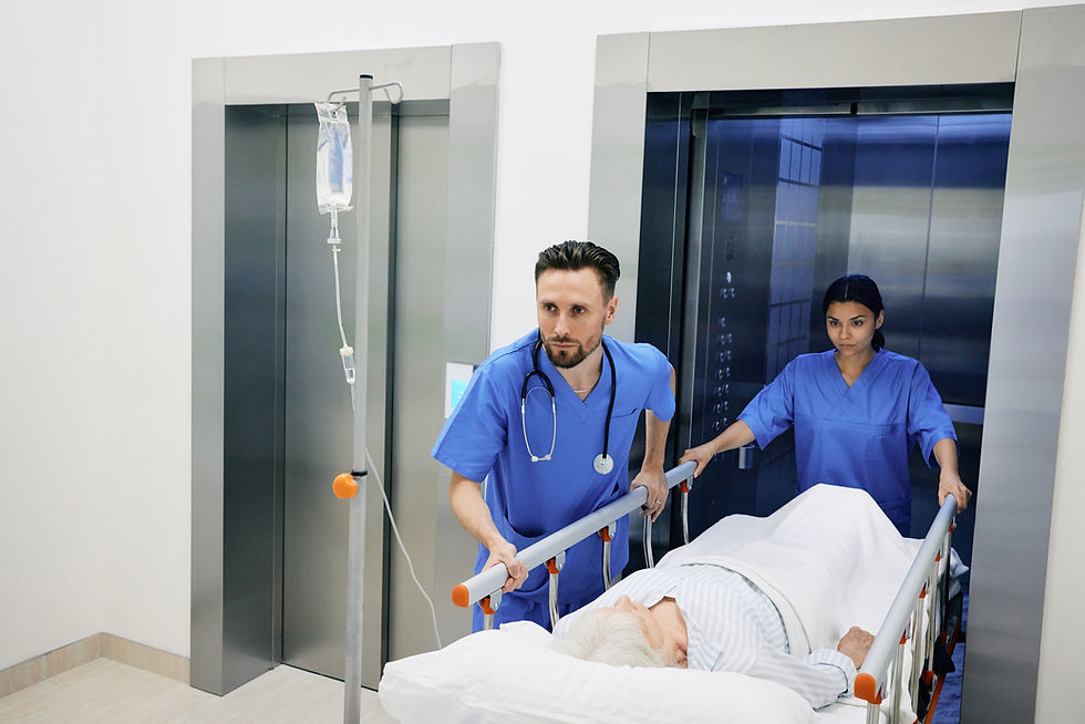 medical-assistant-and-nurse-carrying-sick-elderly-2025-04-01-20-38-45-utc.jpg