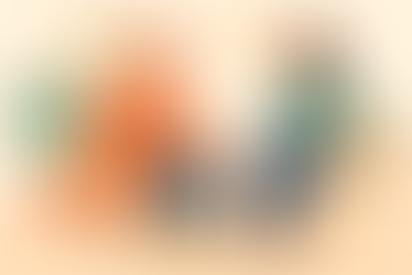 a participant sitting comfortably in a chair with a support worker nearby, in a calm, safe indoor space that suggests emotional support and gentle conversation