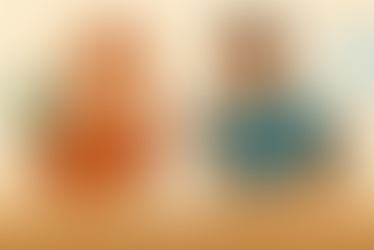 a parent and support worker discussing a document together, with friendly expressions and a calm indoor setting.