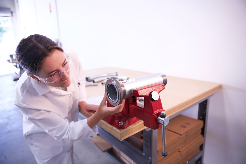 A lab technician checking the quality of conduit