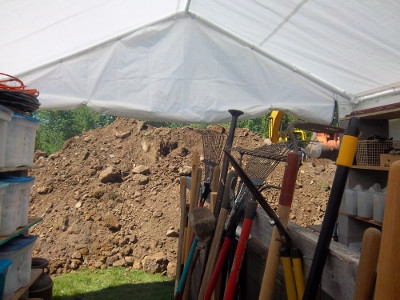 Croftville Road Cottages.
The dirt pile for the septic tank hole continues to grow until we barely have access to our tools and storage shed.
