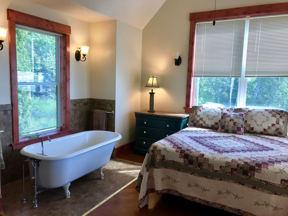 Croftville Road Cottages. Plush queen bed versus clawfoot soaking tub. There is nothing more important than a good night's sleep. Imagine soaking in a hot tub with bath salts after an invigorating day hiking.