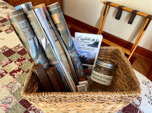 Croftville Road Cottages. When you are ready to sit down to relax around an outdoor campfire or warm yourself inside by your wood fireplace, everything you need to start a fire is provided in this basket found in Inn Suite #8.