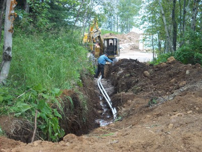 Croftville Road Cottages.
The septic pump lines follow the path up the hill to the new septic mounds.