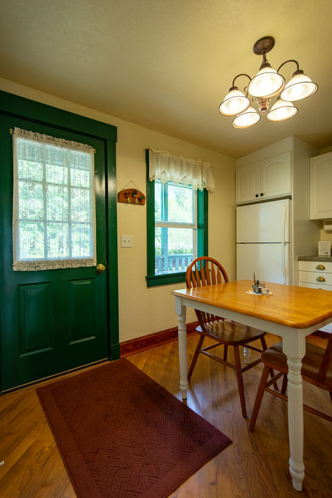 Croftville Road Cottages. Your main entry is into the kitchen in Cottage #3. The table makes it easy to set down your grocery bags and coolers as you put your favorite food and beverage supplies away.