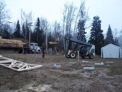 Croftville Road Cottages. Ethan makes sure the trusses stay balanced as Jordan moves them about with the lift.