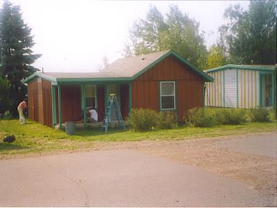 Croftville Road Cottages. Cottage 1 is being painted. In this photo there is a mixture of primers and finish coats visible.