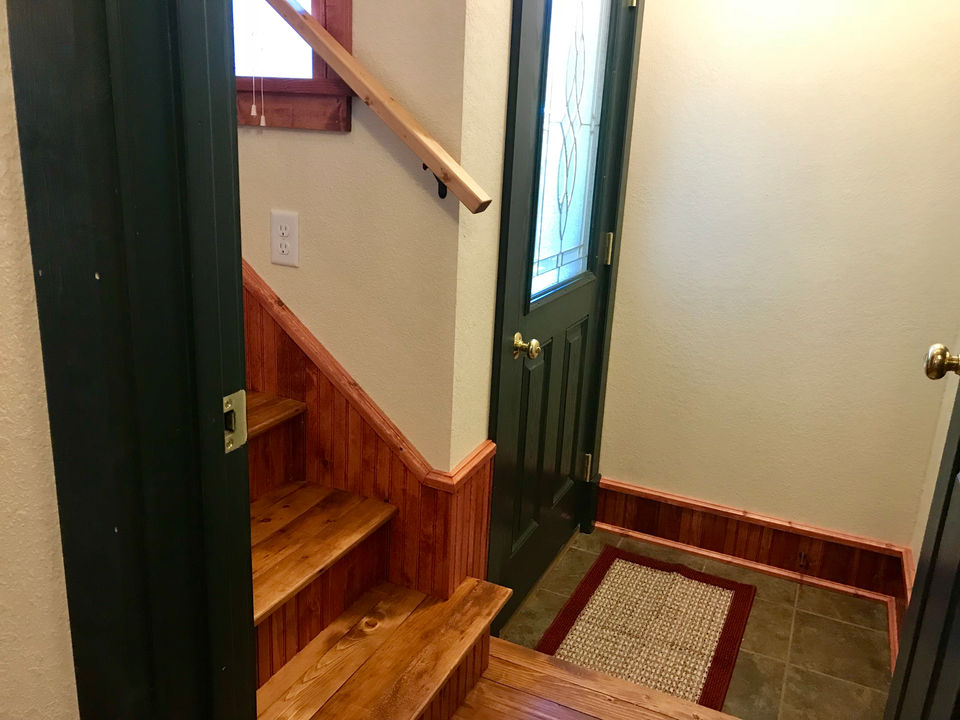 Croftville Road Cottages. Once inside this entryway, you are now halfway up to Inn Suite #8 which sits at the top of The Inn. The stair treads are recycled pine flooring from the original house.
