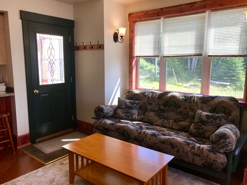 Croftville Road Cottages. Take a family trip to recharge. This living space enjoys a futon that folds into a full-sized bed providing enough sleeping space for your kids while you retreat to the bedroom upstairs.