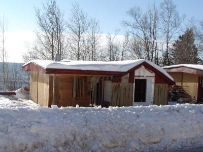 Croftville Road Cottages. Note that in the reframing of Cottage 2 a small section of the original siding has been preserved on the short wall of the entry porch.