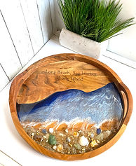 The client provided the stones, sea glass, sand, and memories. We did the rest by adding some ocean tone resin and their favorite vacation beach.