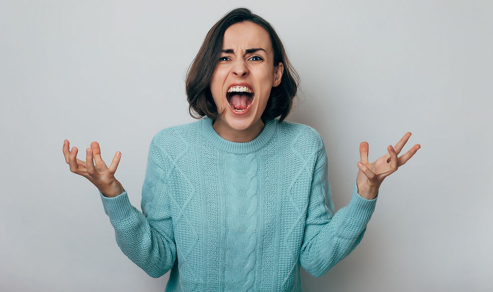 Close up shot of screaming crazy frustrated woman with anxiety, anger and depression. Very