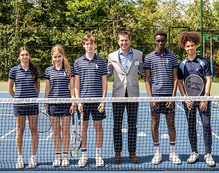 Tim Henman with students at the Raynes Park High School press launch for new tennis courts funded by his foundation