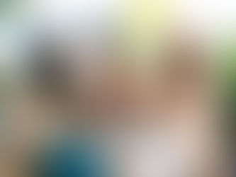 Three women sit together outdoors, smiling and clinking clay mugs of cacao in warm sunlight. Their laughter and connection reflect the joy and ease of partnership, symbolizing how collaboration creates authentic, heart-led relationships in business and life.