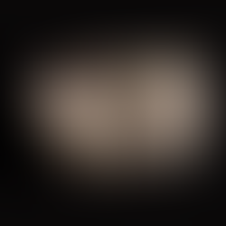 Gold-bearing sulfide ore with pyrite and arsenopyrite crystals showing metallic luster and dense mineralization.