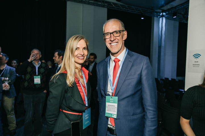 2 people smiling at a networking event