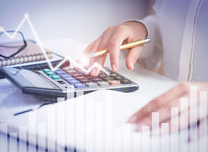 accountant-calculating-profit-with-financial-analysis-graphs-min.jpeg