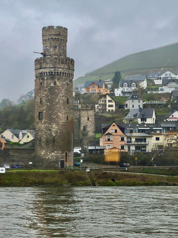 A medieval tower on a rainy day along the Rhine