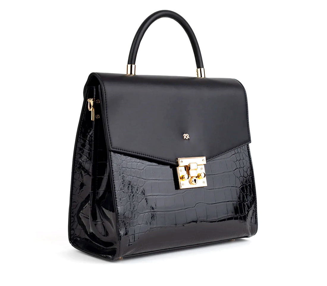 Elegant black handbag with top handle and gold clasp, new item shop.