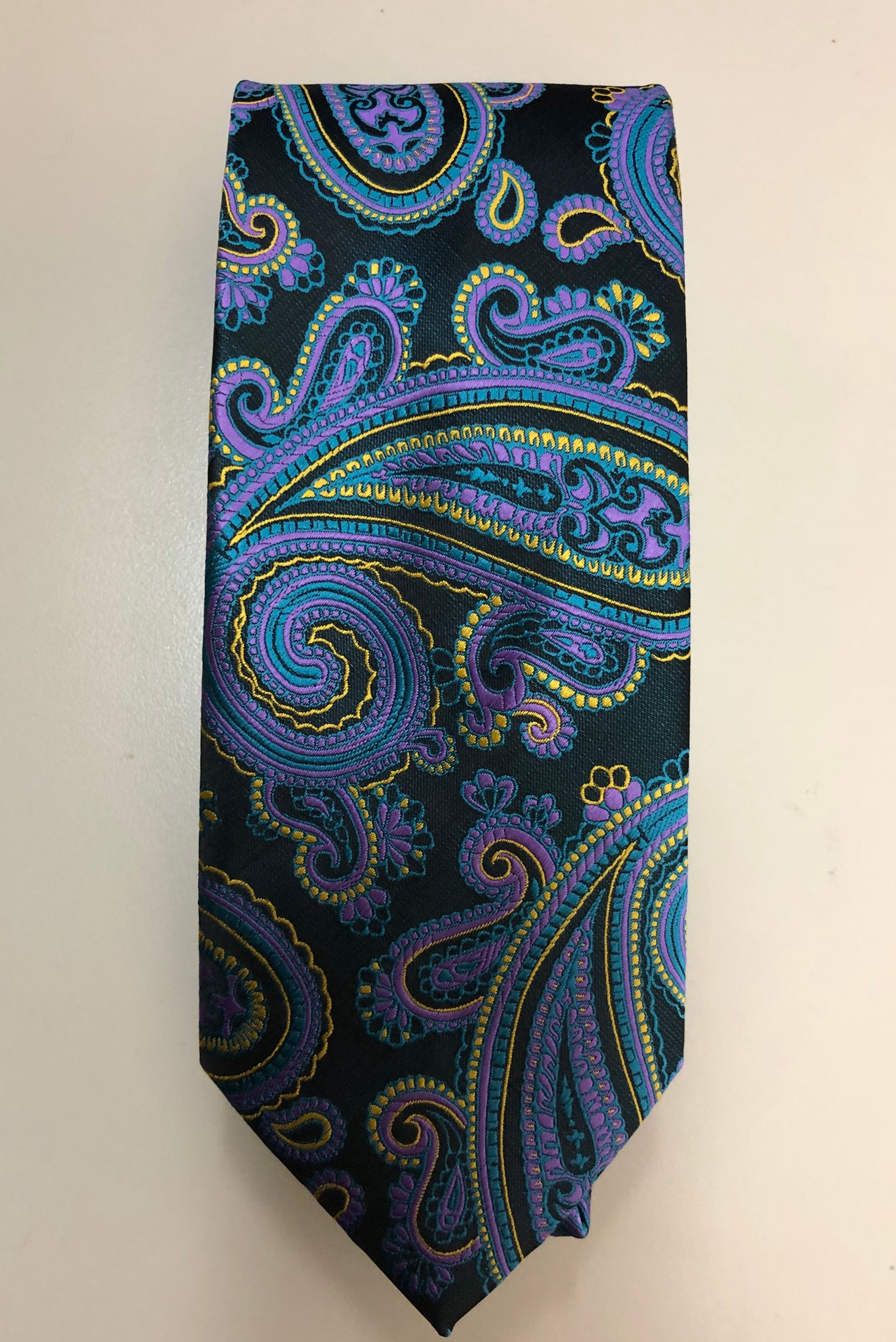 “Men’s paisley necktie in black, purple, and yellow combination with elegant formal design.”