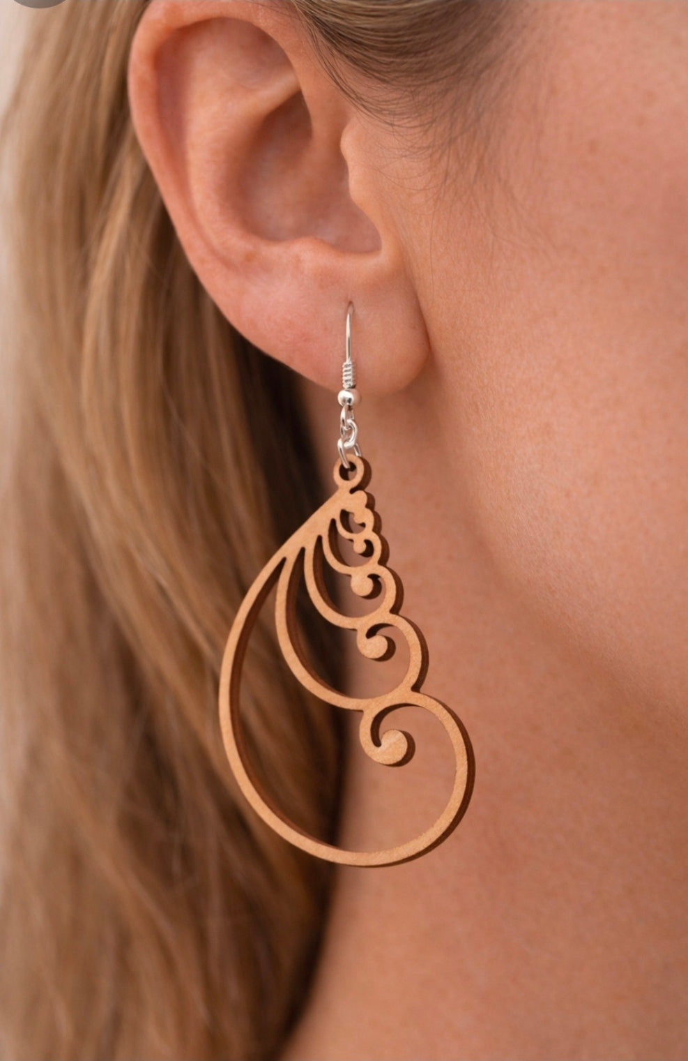 Handmade Fibonacci spiral dangle earrings crafted from lightweight wood, featuring a bold geometric statement design.