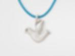 "Oxidized sterling silver dove pendant with detailed wings and a dark, antique-style finish."
