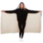Woman wearing MONSTERA EXOTICA - AZURE Hooded Blanket, arms outstretched, showing the blanket.