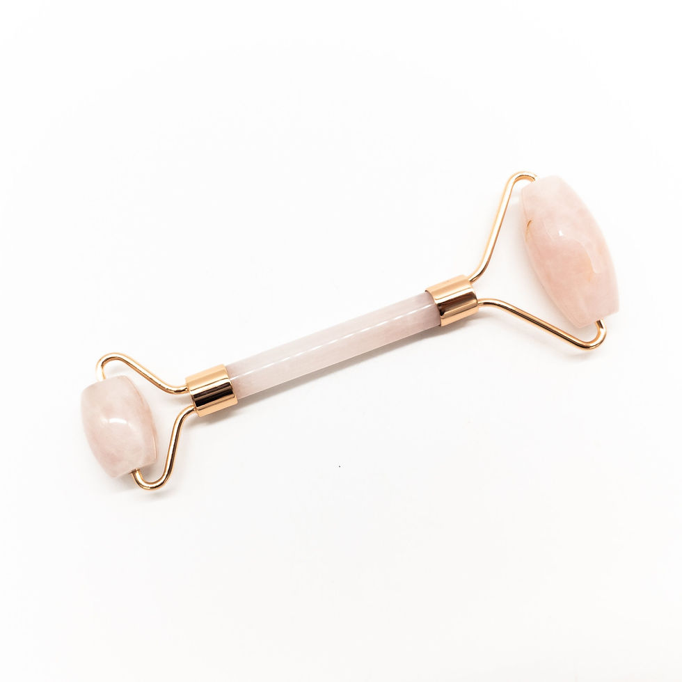 Copper and crystal face roller massager designed to gently massage skin and promote relaxation and glow.
