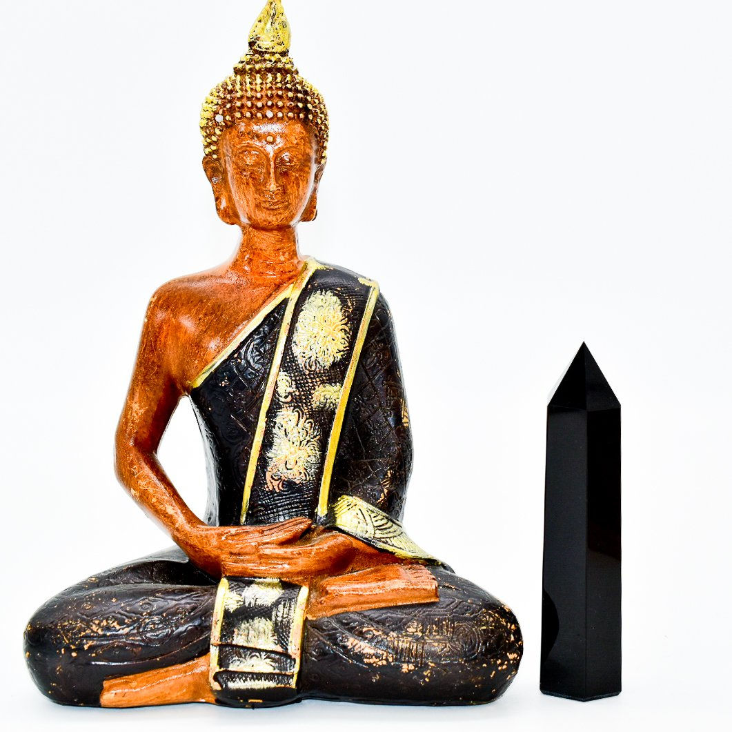 “Black onyx crystal point for energy healing, meditation, and spiritual home decor.”