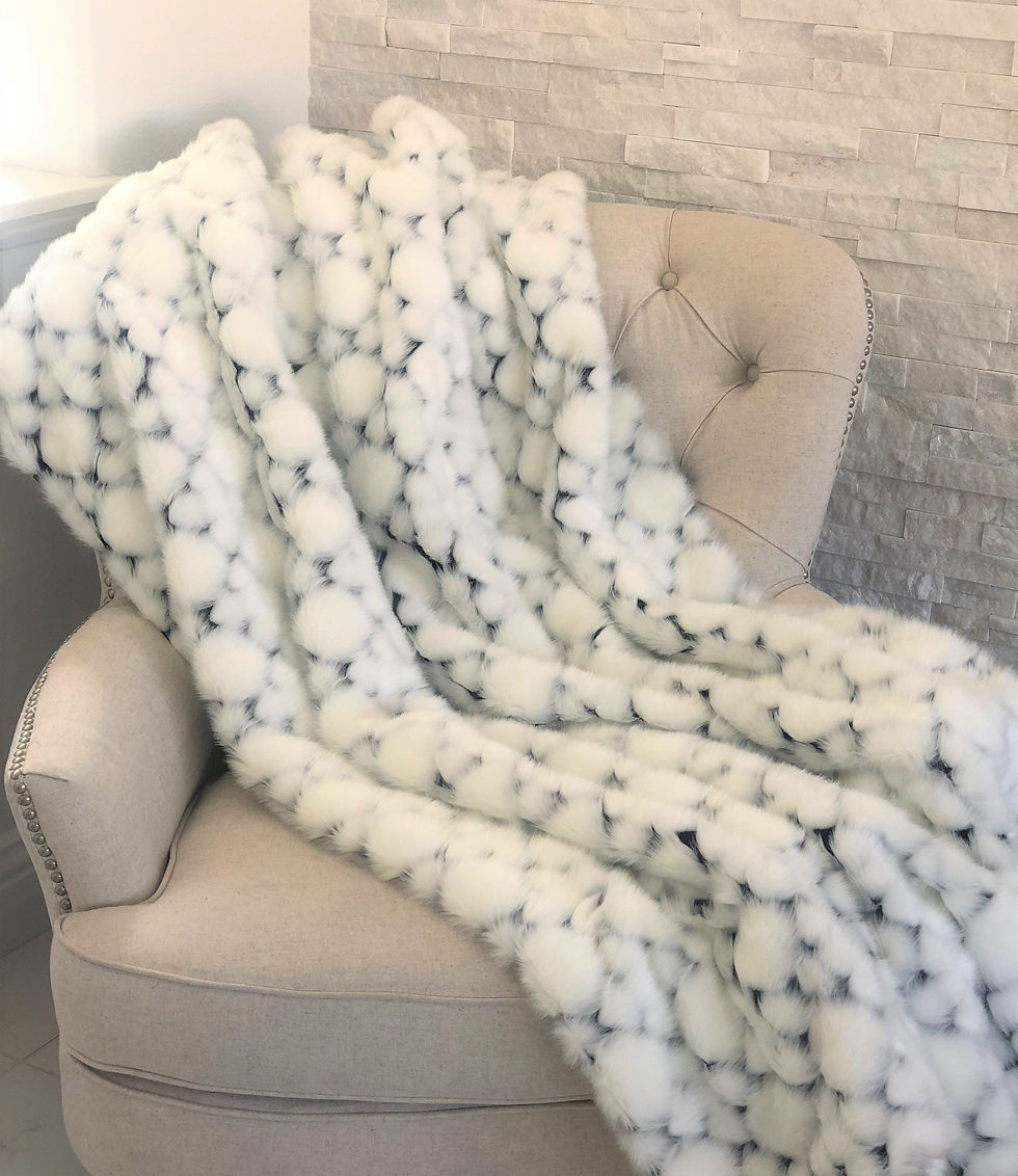 "White With Black Shades Faux Fur Snow Luxury Throw: Luxuriously soft and adding sophistication and warmth."
