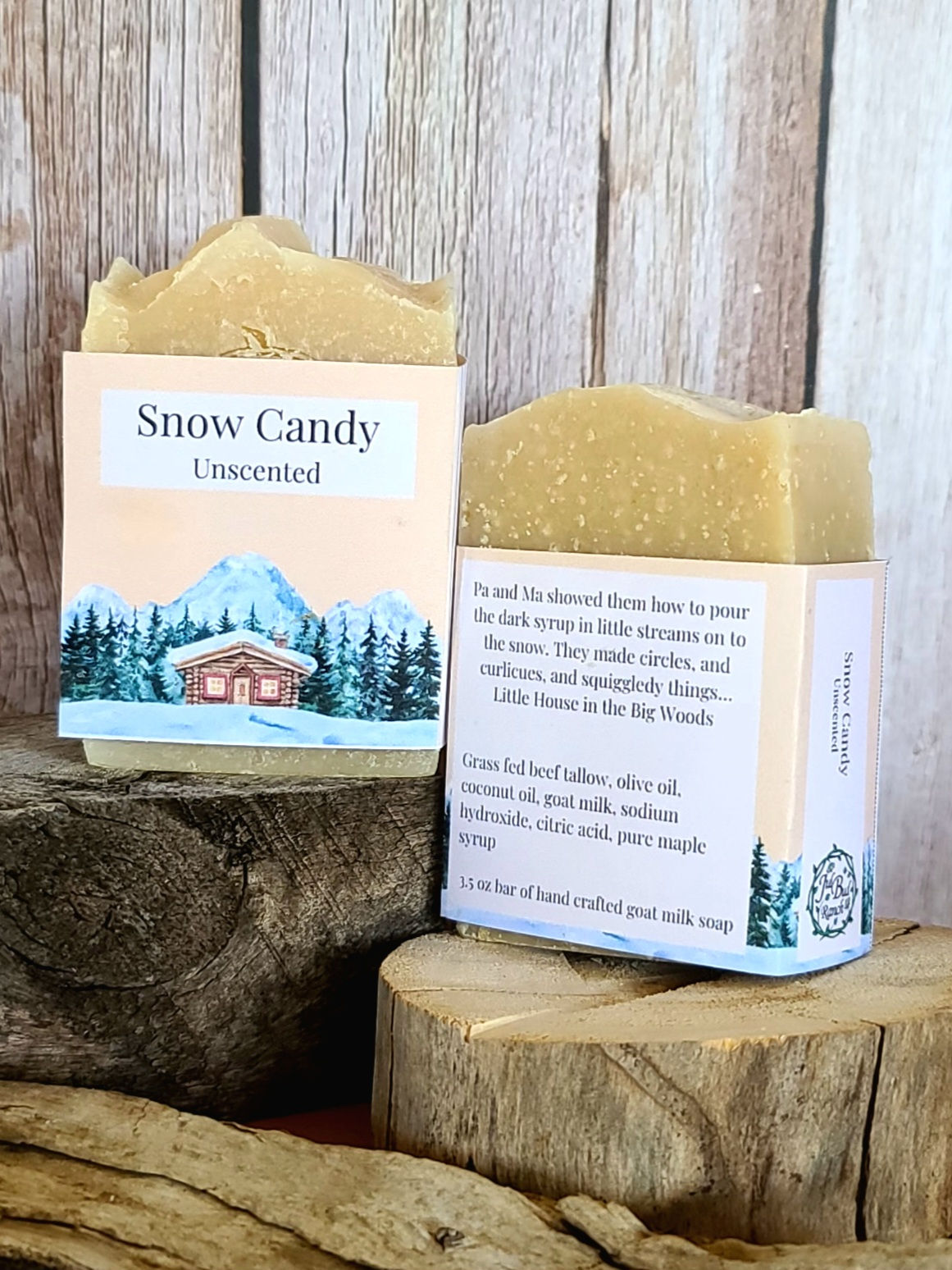 2 bars of soap sitting on pieces of wood in front of a wood background.