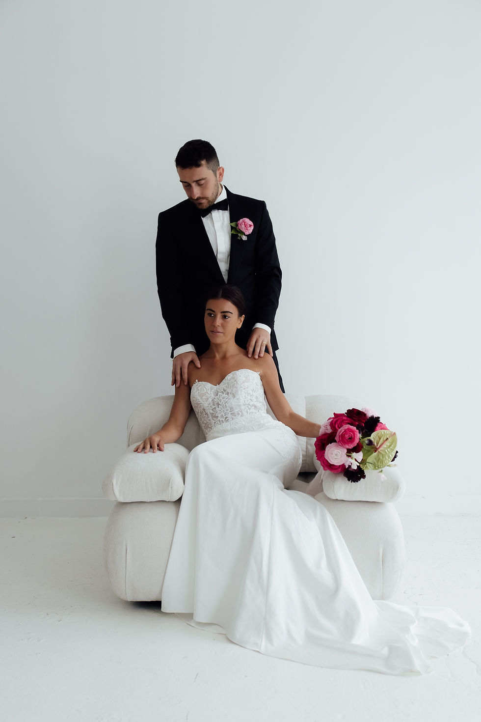 Modern bridal portrait in minimalist studio with colourful wedding flowers in Sheffield