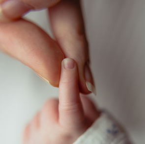 Newborn baby photographed during a relaxed at-home session