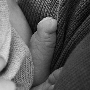 Newborn baby photographed during a relaxed at-home session