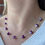 Thumbnail: Model wearing our Wisps Beaded Necklace in Magenta