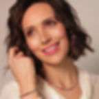 Model wearing a fully beaded Rainbow Pearl necklace and Rainbow Pearl bracelet