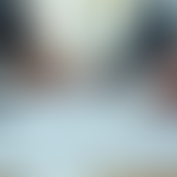 business men seated at desk with typed documents on table signing contract