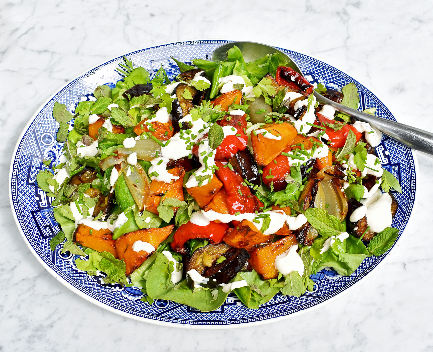 Roast vegetable warm salad with a yoghurt tahini dressing