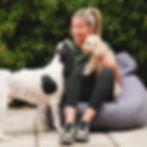 Emily sitting with 2 dogs