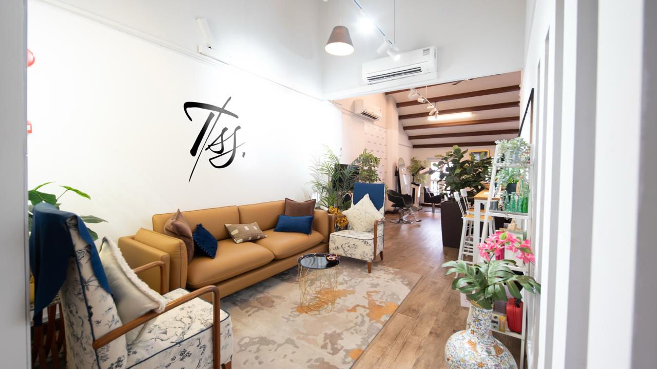 Comfortable reception and consultation lounge at The Scalp Studio Singapore